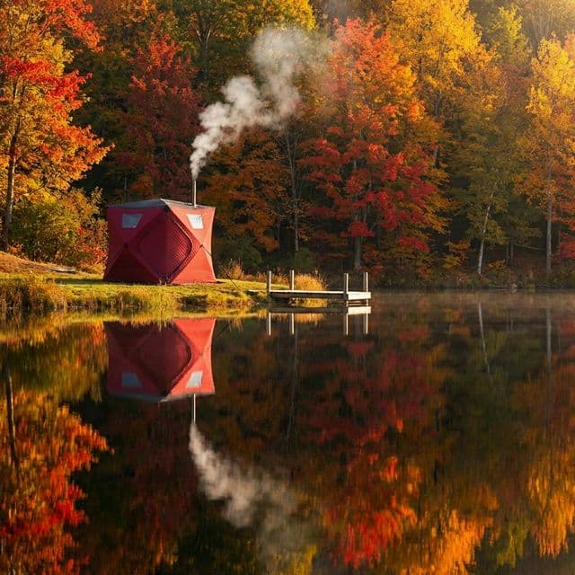 Sauna tent near lake in autumn